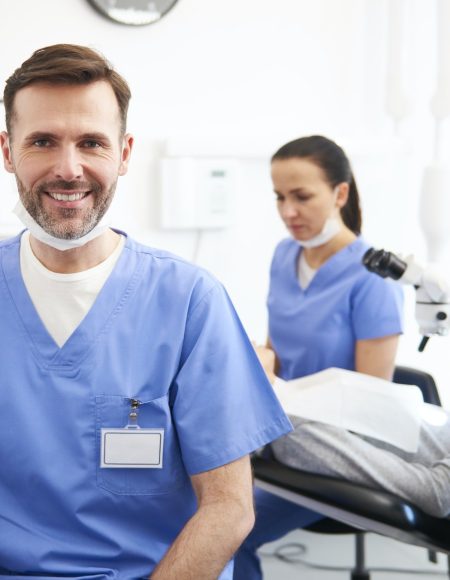 portrait-of-smiling-male-dentist-in-dentist-s-clinic.jpg